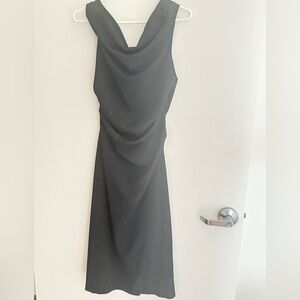 Classic black dress with scoop neck and ruching